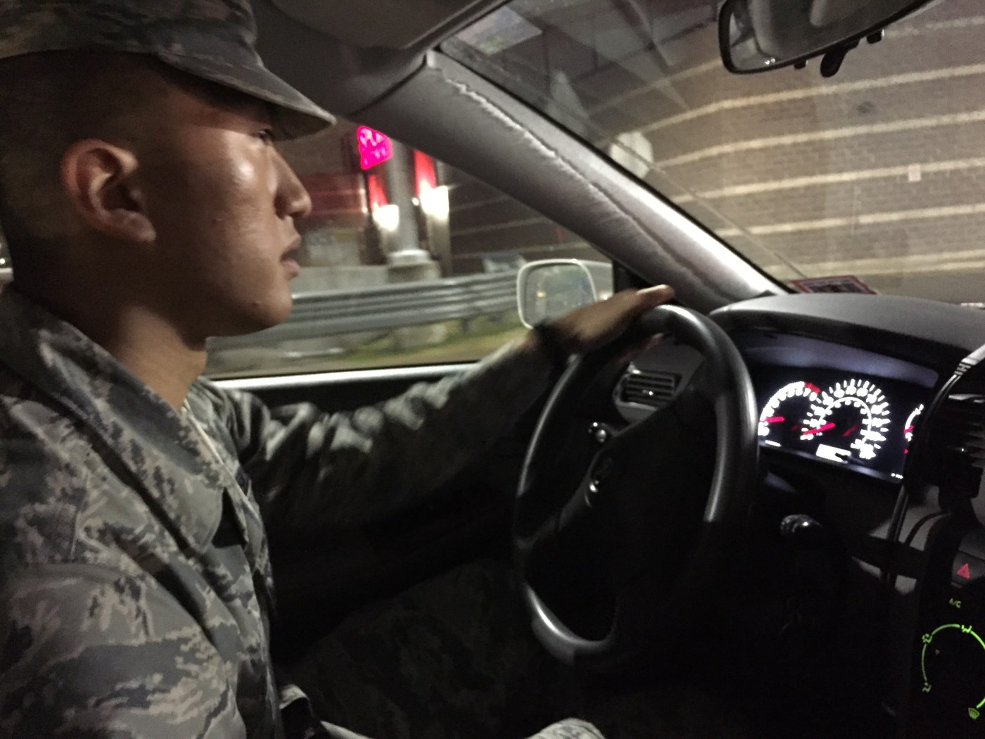 Jake Song driving in uniform at night